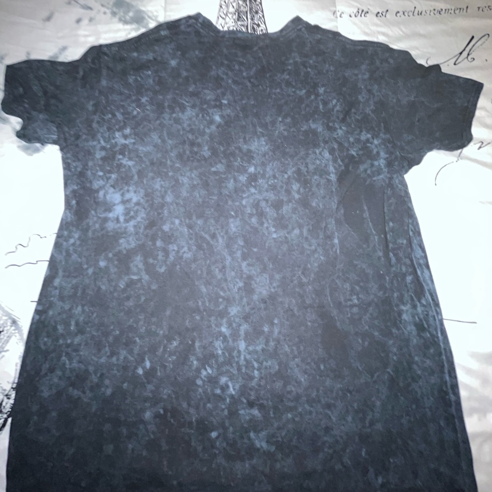 Here I have a black and blue graphic shirt from boohooMAN.